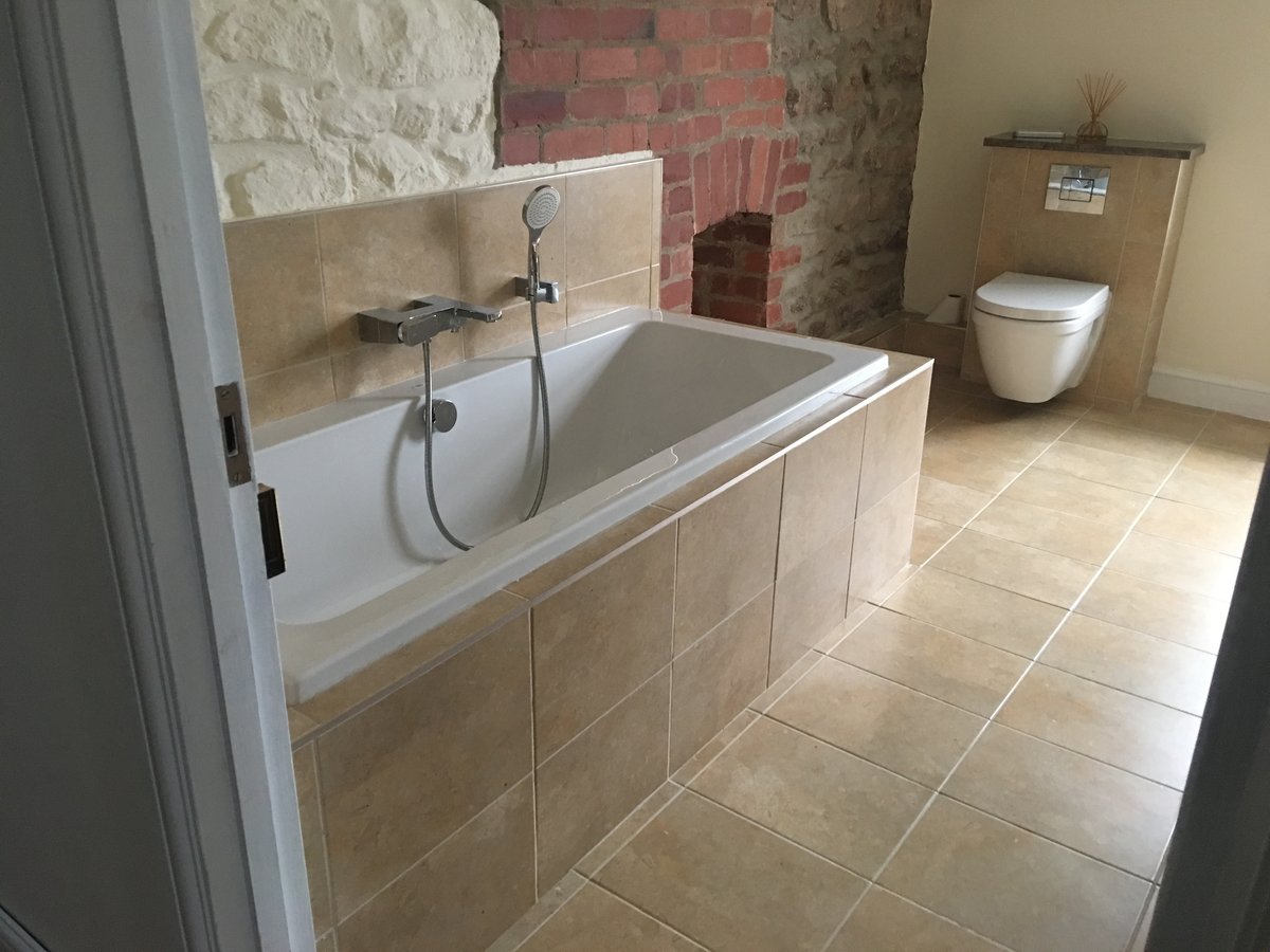 An image of bathroom renovation stone floor mork  goes here.